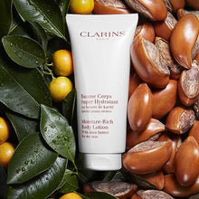 Load image into Gallery viewer, Clarins Moisture-Rich Body Lotion | Intensely Hydrates | Nourishes, Softens and Smoothes | Non-Greasy and Fast Absorbing | 88% Natural Ingredients | Body Cream With Shea Butter | For Dry Skin Types
